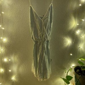 blue cross back romper with lace detail